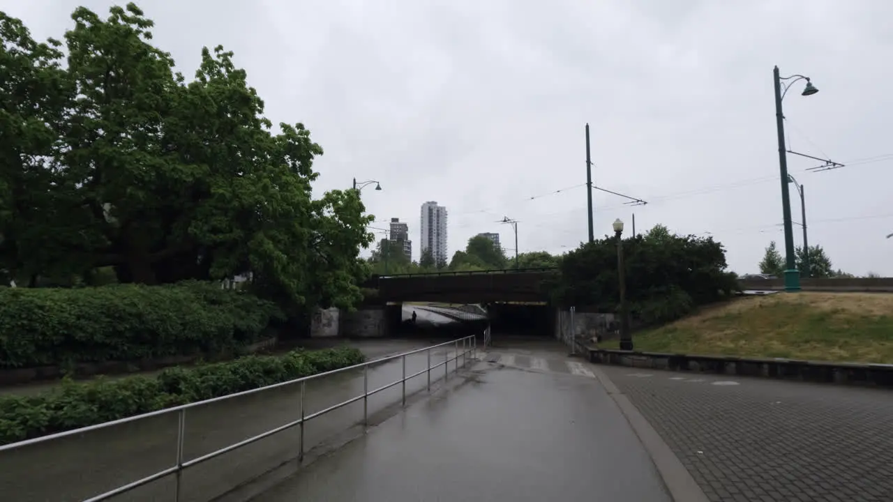 Vancouver Suburbs in Rainy Day Street and Pedestrian Pathway Under Bridge