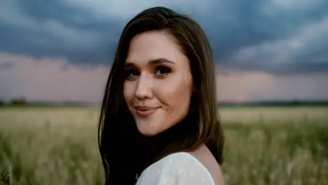 Bride posing in a field