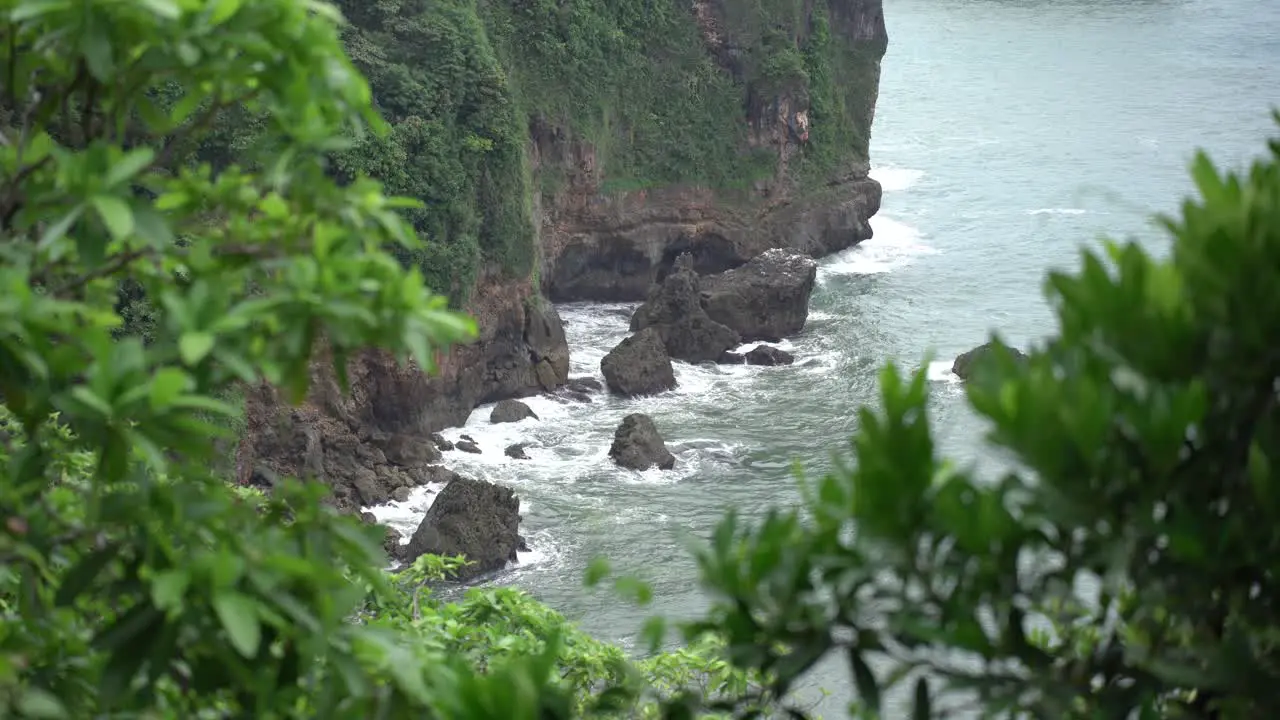 The waves crashing against the rocks on the coast of the South Sea of Java