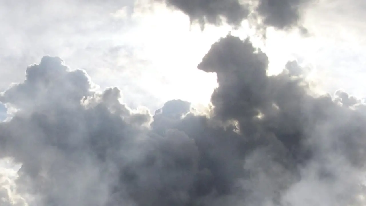 thick cumulonimbus clouds in a clear blue sky