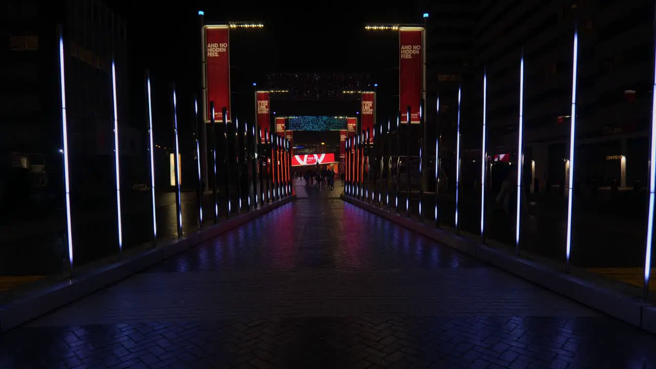 Colourful abstract illuminated corridor artwork installation at Wembley park Winterfest during nightfall