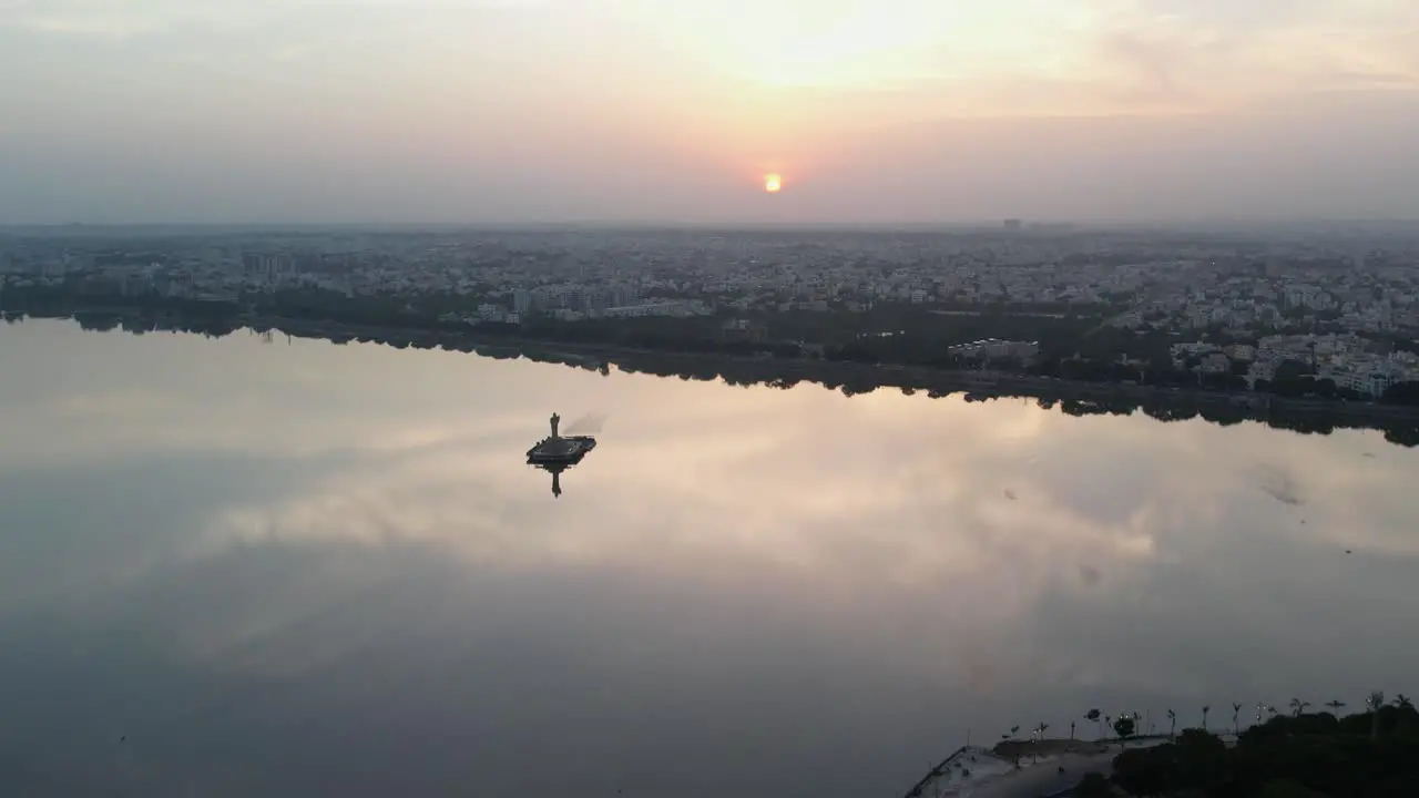 A beautiful sunrise over the Indian city of Hyderabad cinematic footage of Hyderabad's most famous area Hussain Sagar Lake