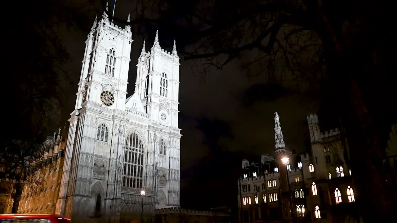 London Double Decker Buses Driving Past Westminster Abbey London United Kingdom