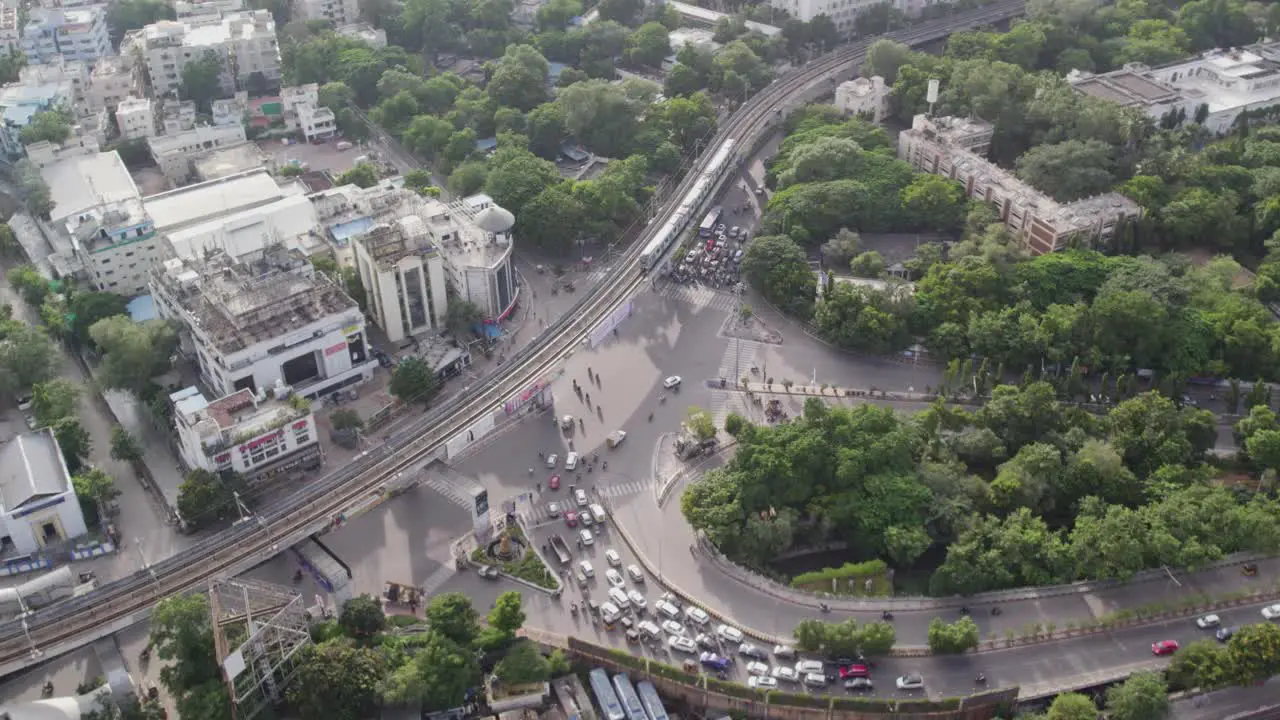 Aerial view of a bridge in the middle of the city with a metro train crossing it