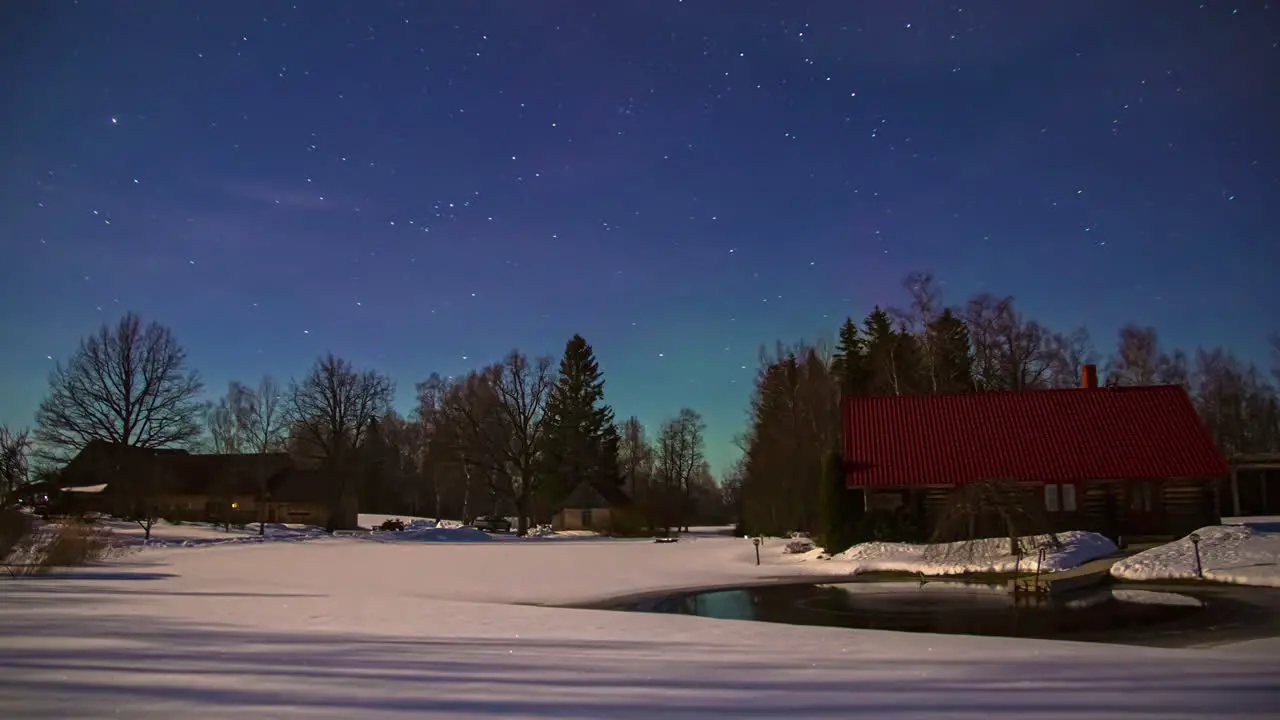 Beautiful Stars And Aurora Borealis At The Night Sky At Winter