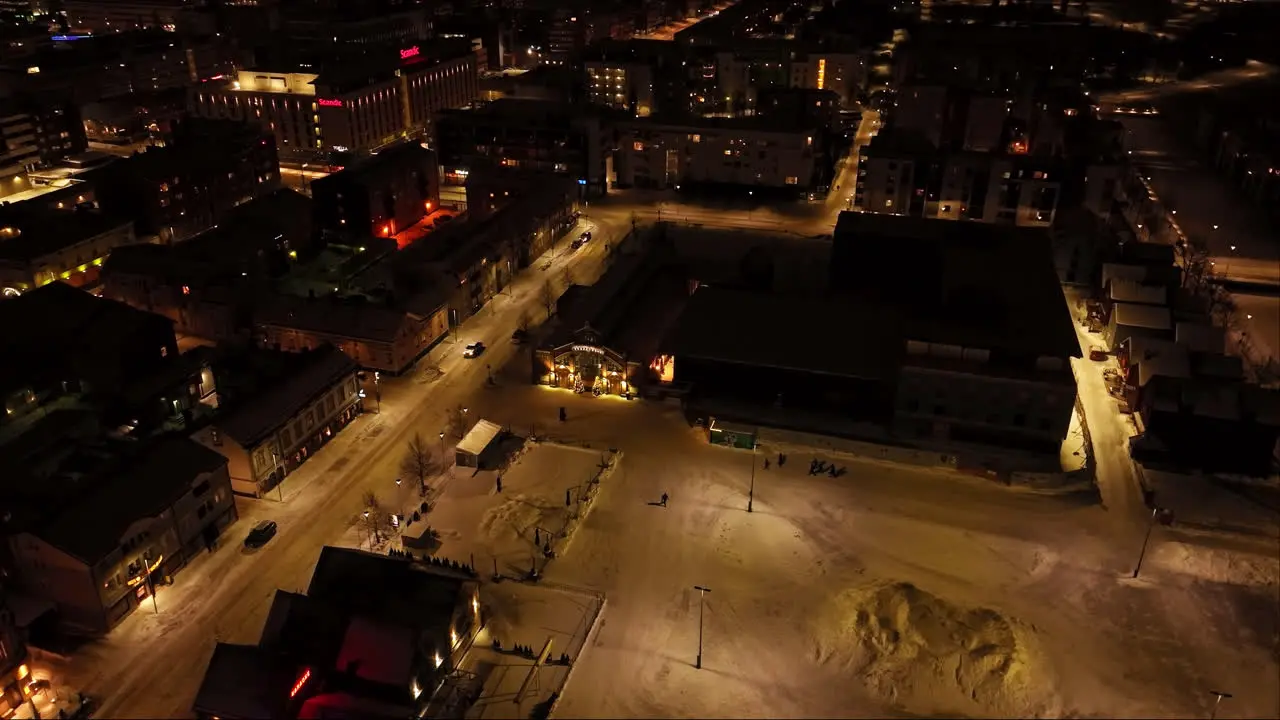 Aerial view around the illuminated market hall winter night in Oulu Finland