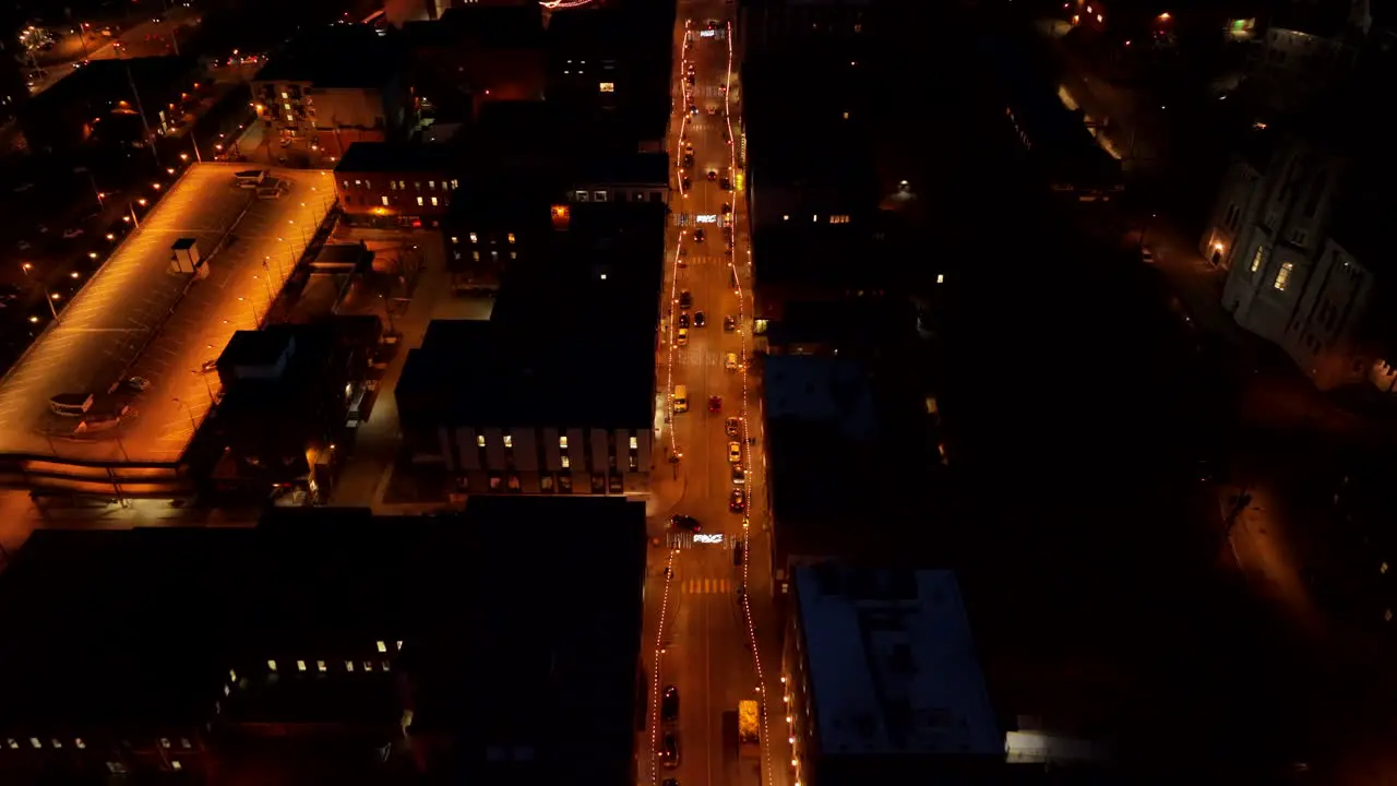 Street Of Sherbrooke City Illuminated With Lights At Nighttime In Canada aerial pullback