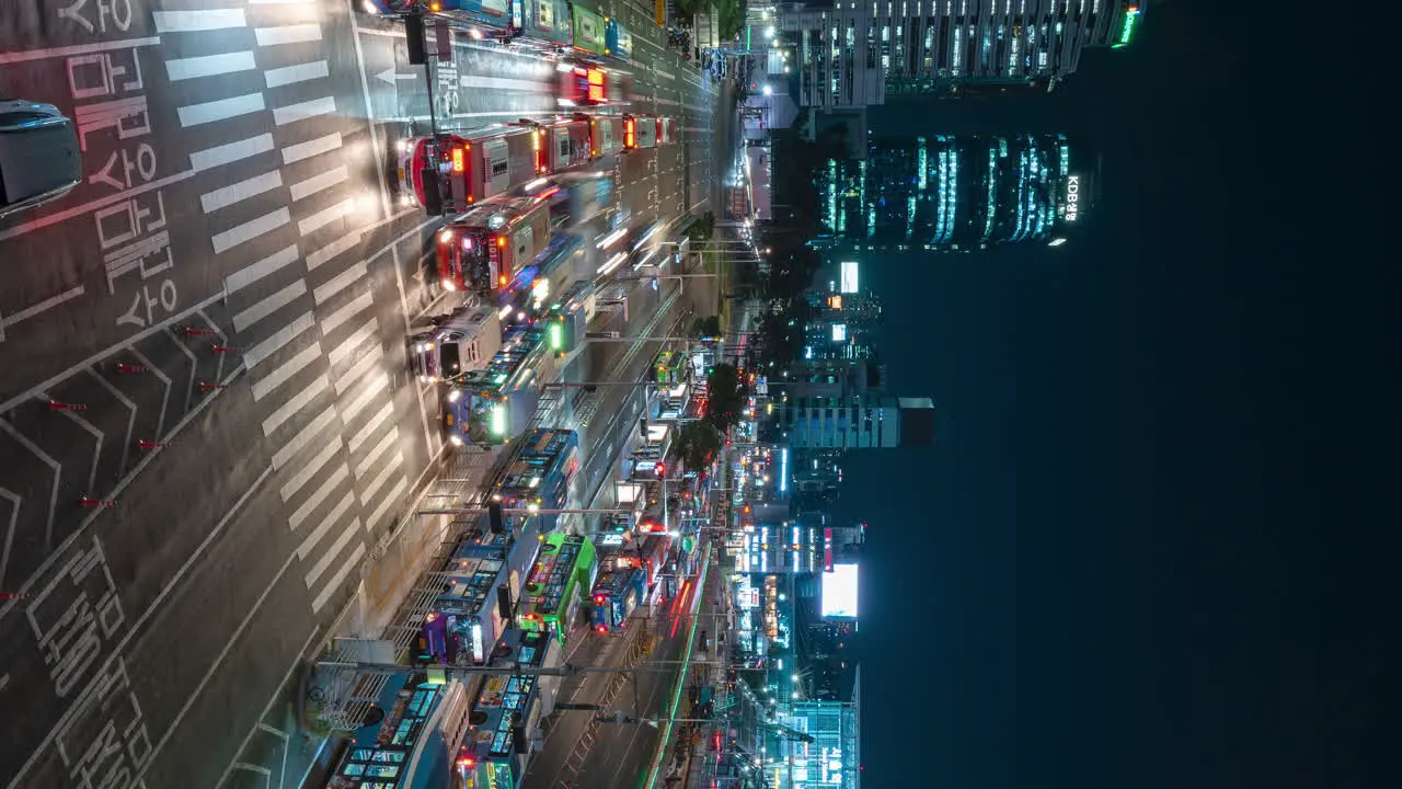 Night Driving Cars with Light Trails at Seoul Station Bus Boarding Terminal Vertical Panning Hyperlapce Elevated View