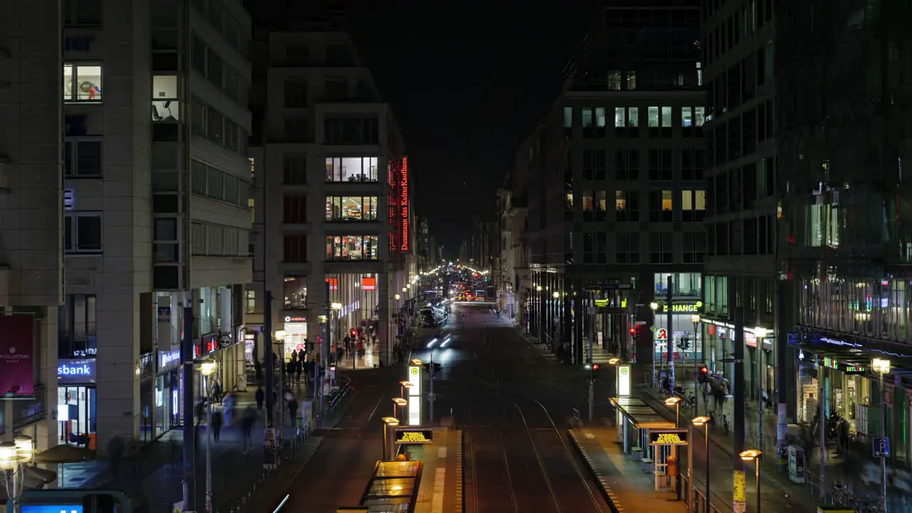 Busy Friedrichstrasse city centre avenue illuminated at night Berlin time lapse