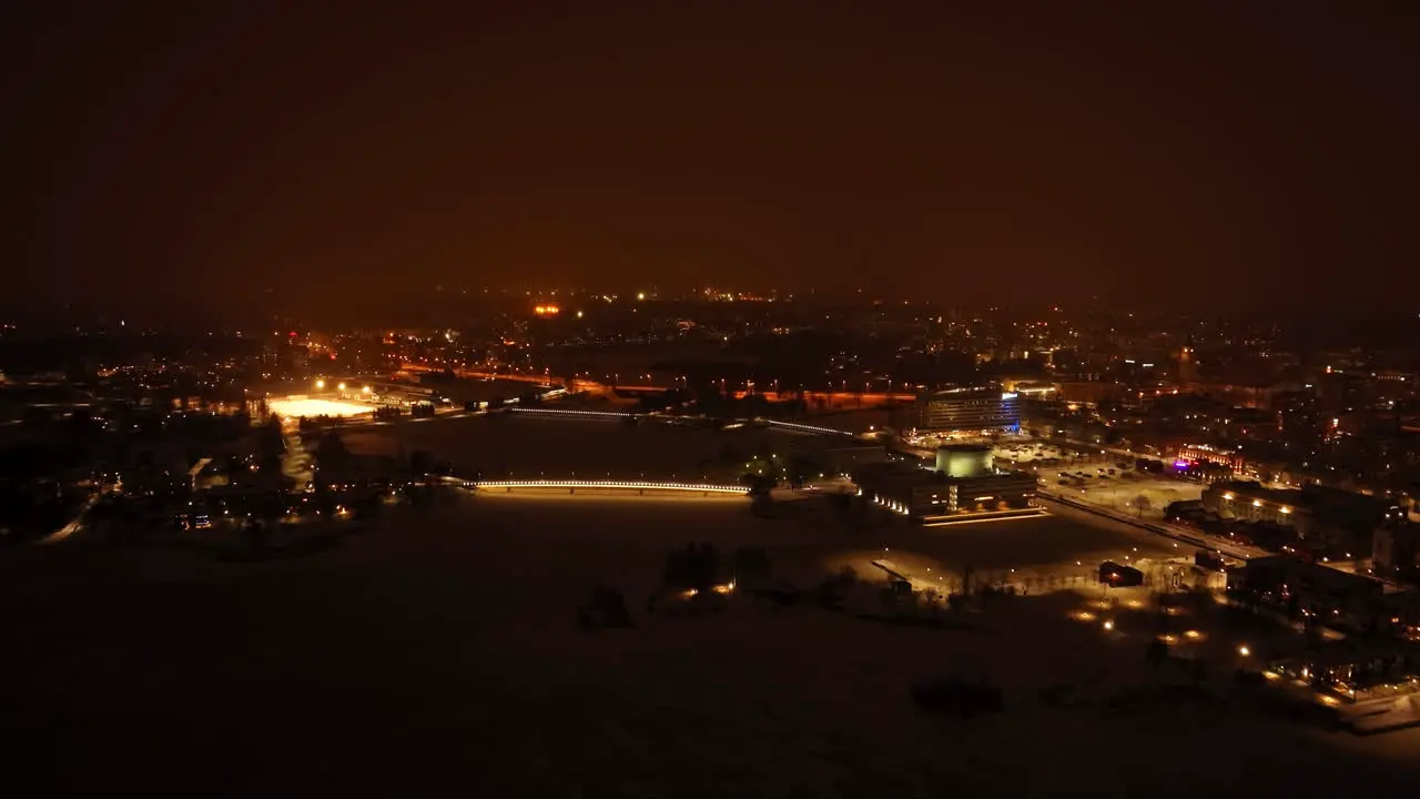 Establishing drone shot of the coast of Oulu city winter night in Finland