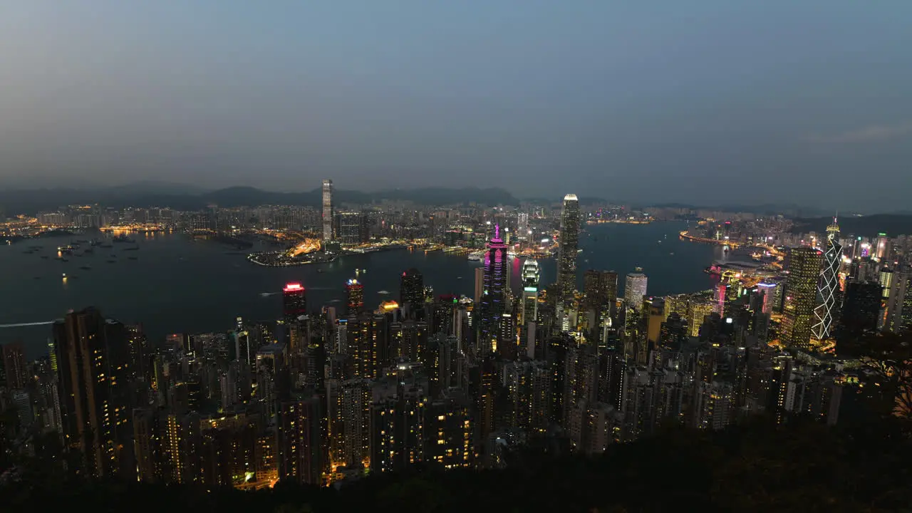 Evening to night time-lapse of the illuminated skyline of Hong kong city