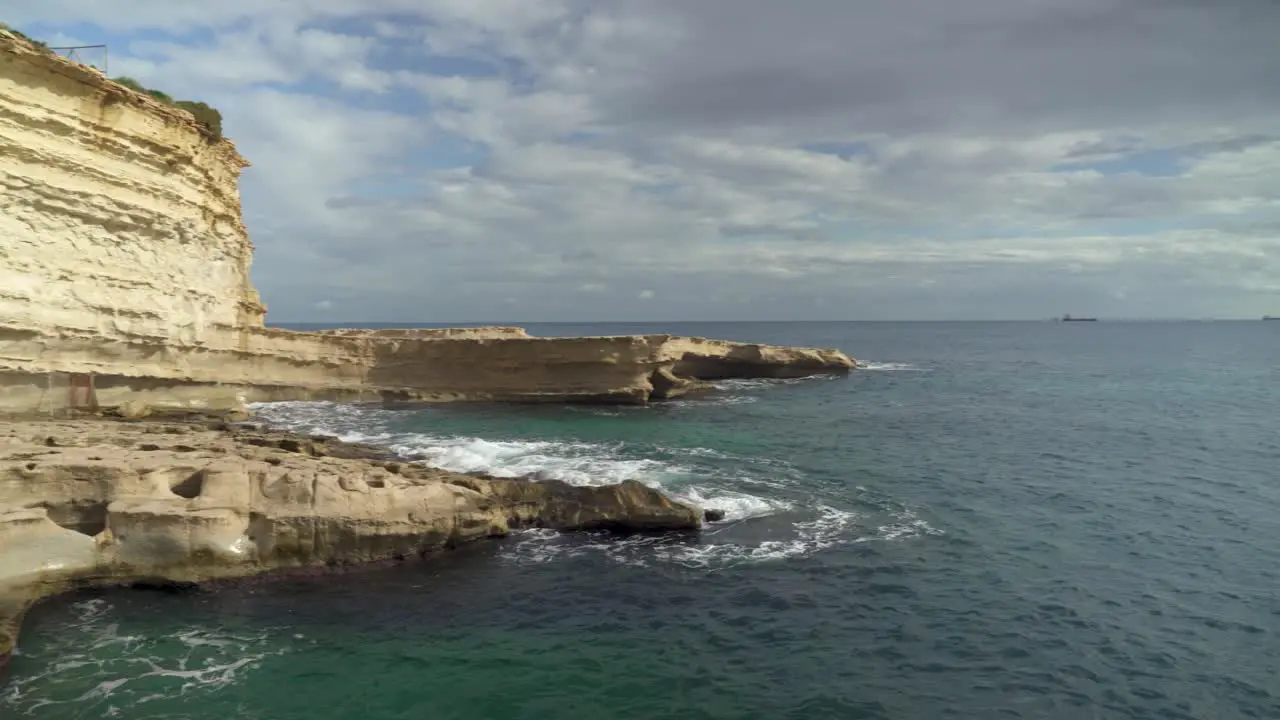 Panoramic View of St Peter’s Pool Stone Beach with Limestone Slope and Mediterranean Sea