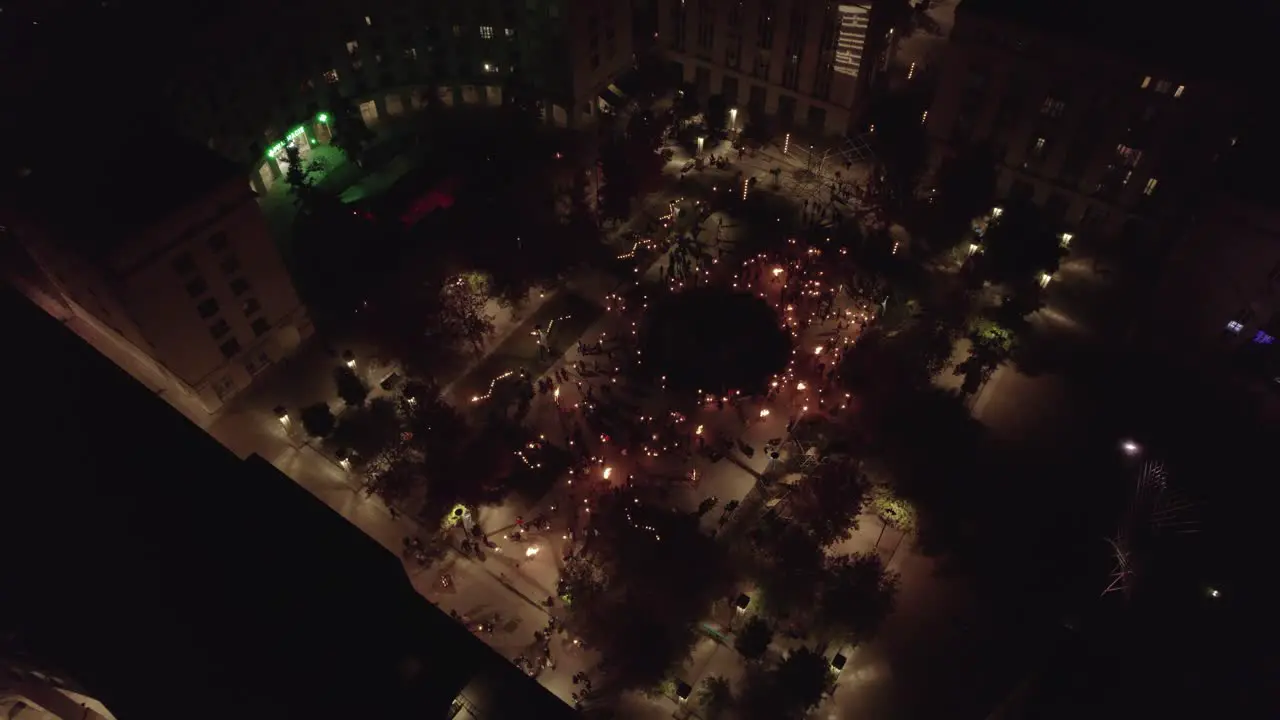 Aerial view of square at night time with people enjoying the acrobat event in Antigone Montpellier