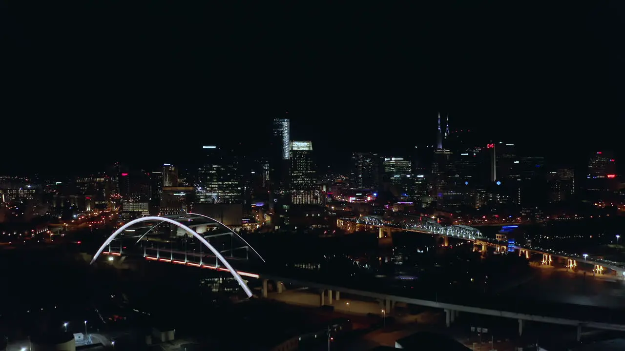 Orbiting aerial of downtown Nashville Tennessee city skyline at night Drone 4K