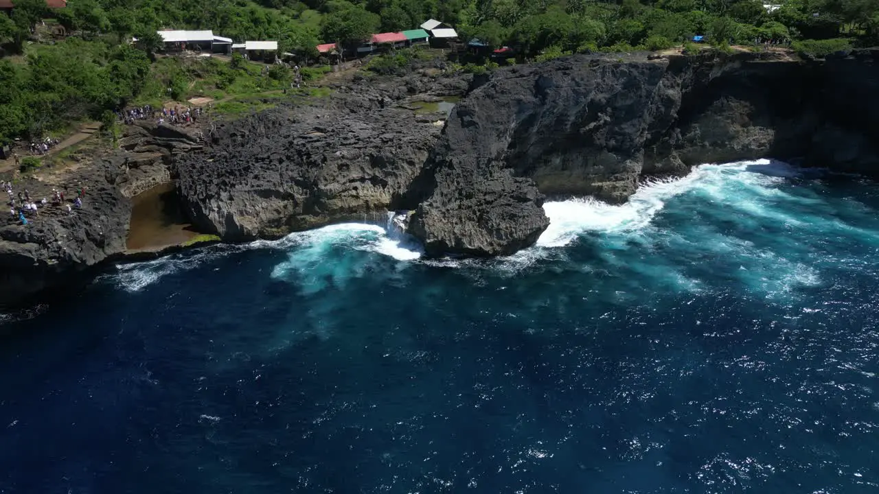 Coastal cliffs on the island of Nusa Penida with crashing waves