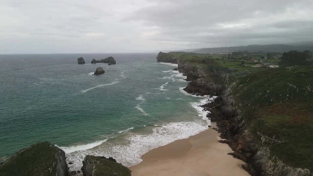 Aerial view of cliff with beach and ocean in Northern Spain