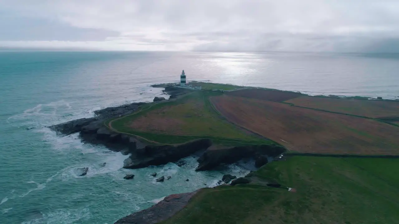 Lighthouse on a rocky shore aerial