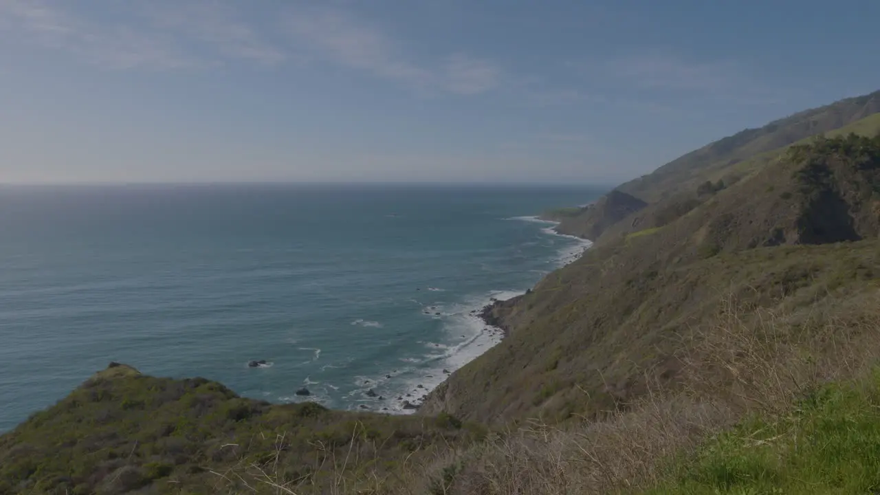 Stationary distance shot of waves rolling though the Pacific Ocean located in Big Sur California