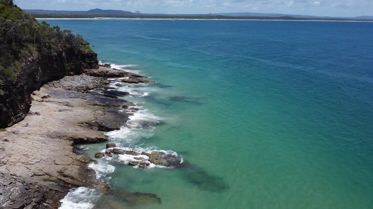 Low flying over rocky beach