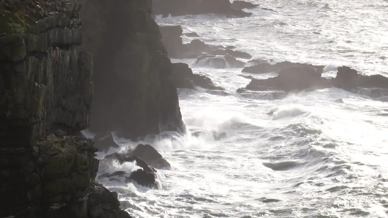 Slow Motion Stormy Sea Waves Against High Cliffs Wales