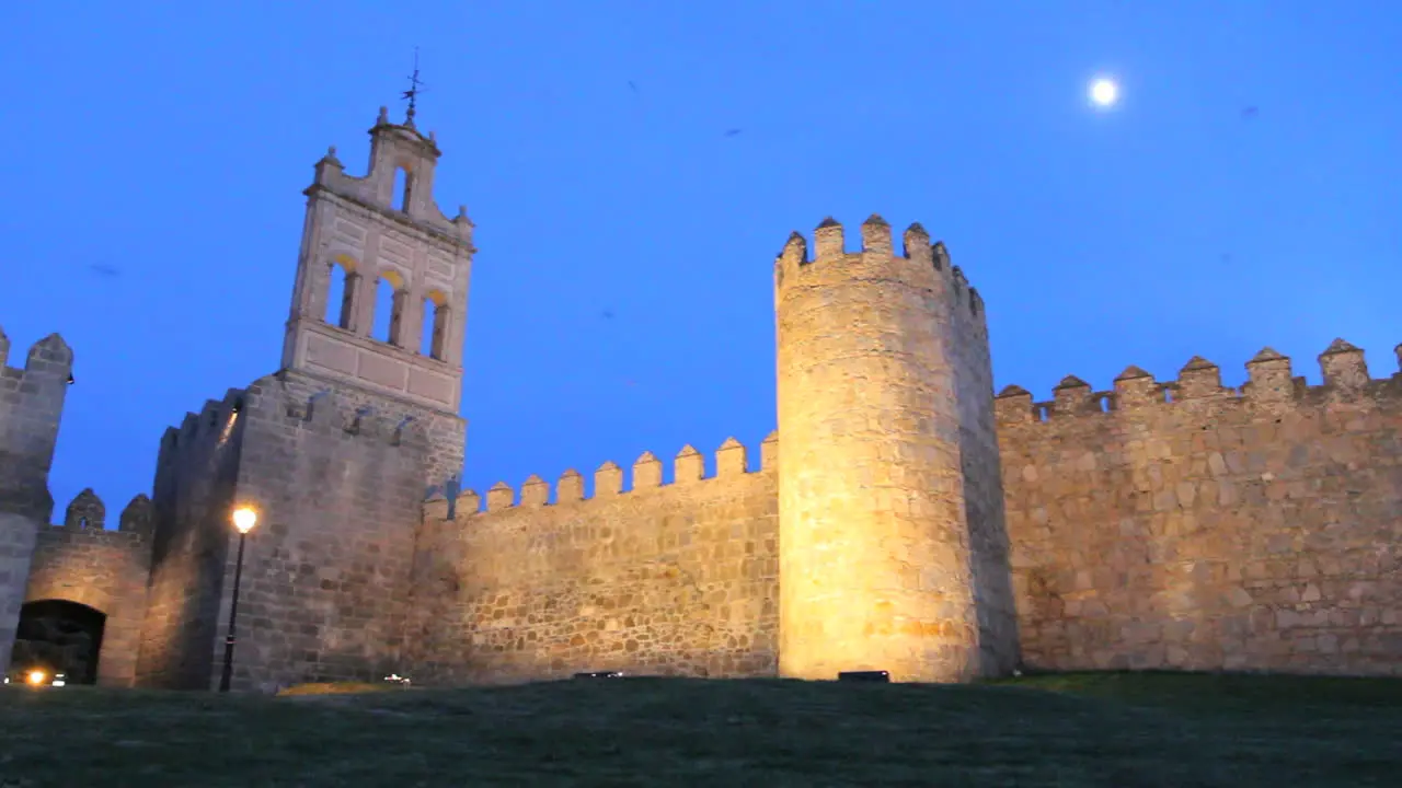 Spain Avila gate and walls with moon