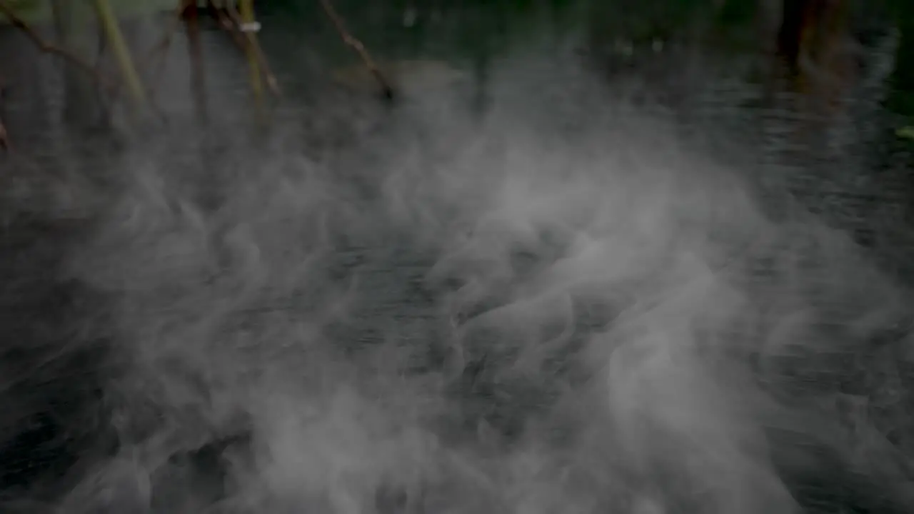 Eerie Misty Fog Floating Over Water Surface