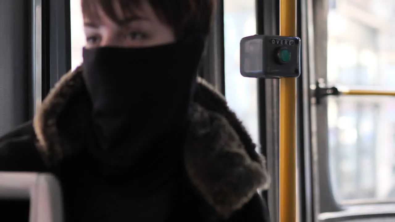 Female Passengers With Face Masks Sitting and Talking in Tram