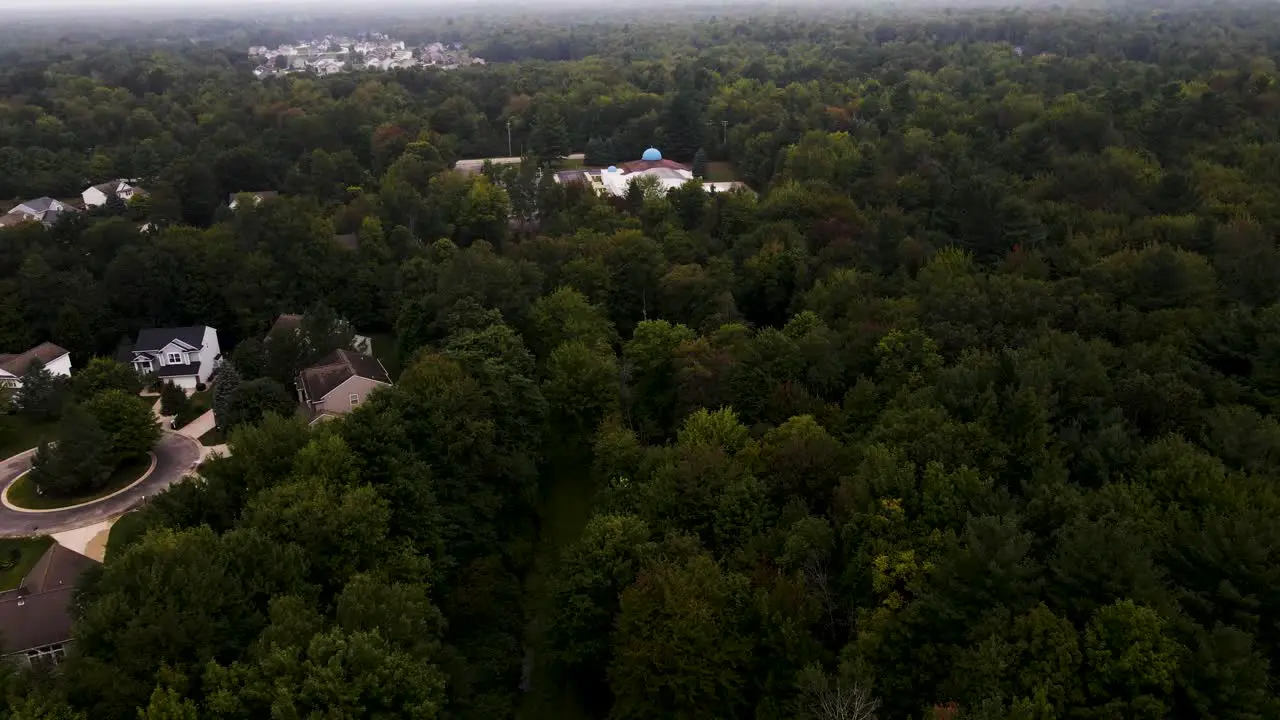 Tilting to an Orthodox Church in Muskegon hidden in the trees