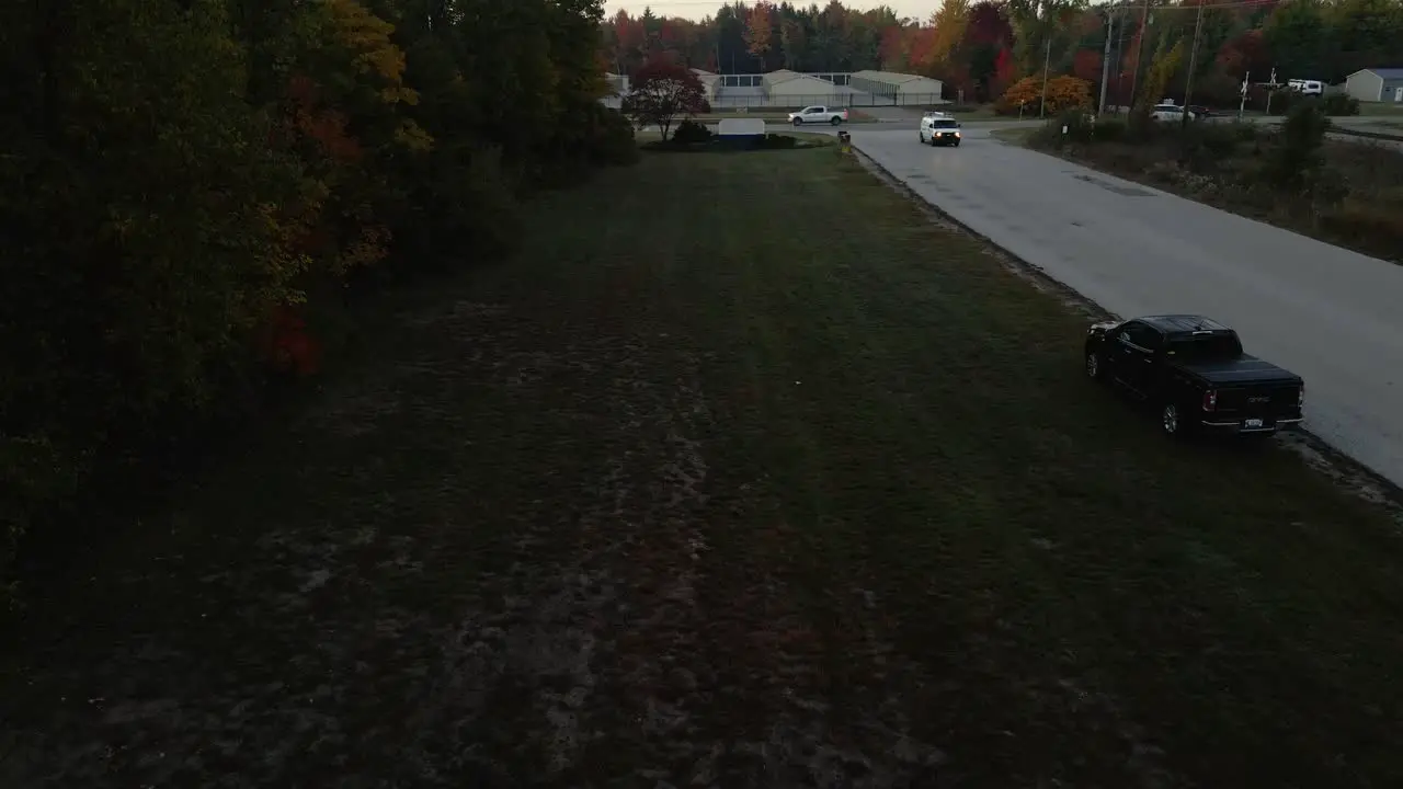 Drone descending near a factory entry road in Muskegon