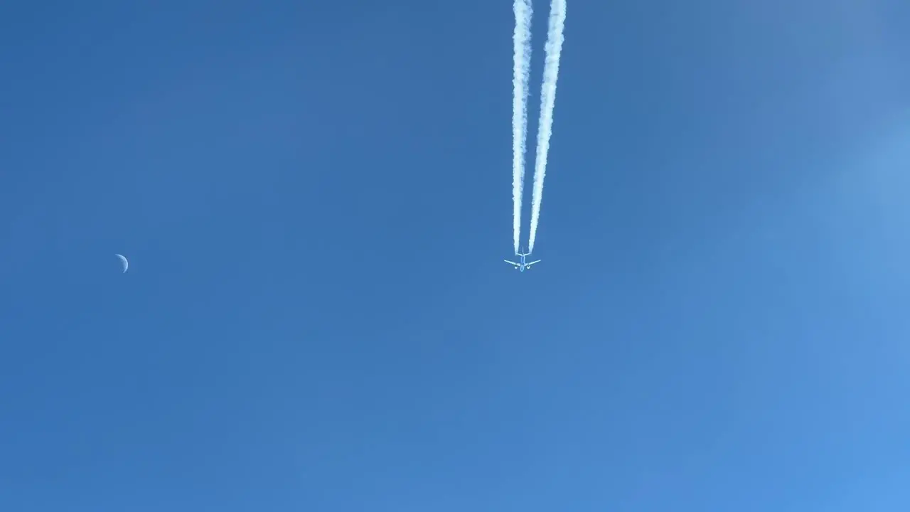 Awesome and unique pilot point of view of the wake of Airbus jet flying 2000 ft avobe in the same route with a waning moon in the high taken at 12000 metres