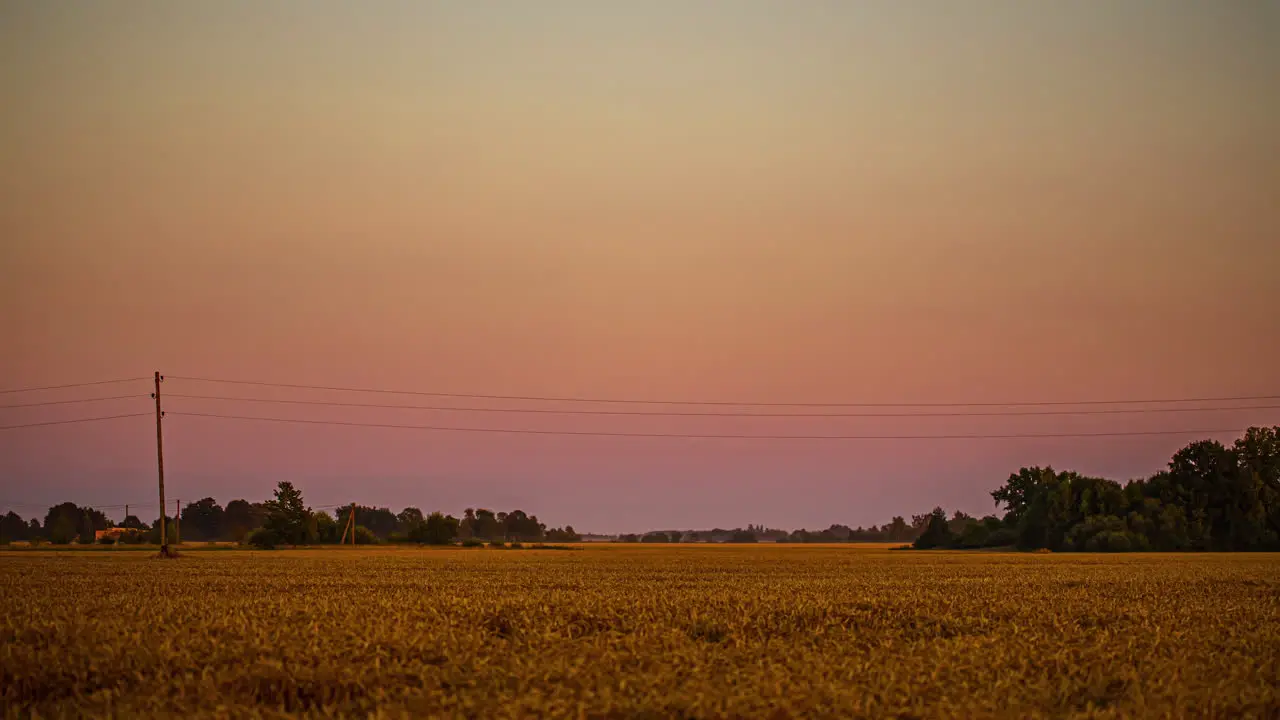 Nightfall over farmland the a new super moon rising over the countryside time lapse