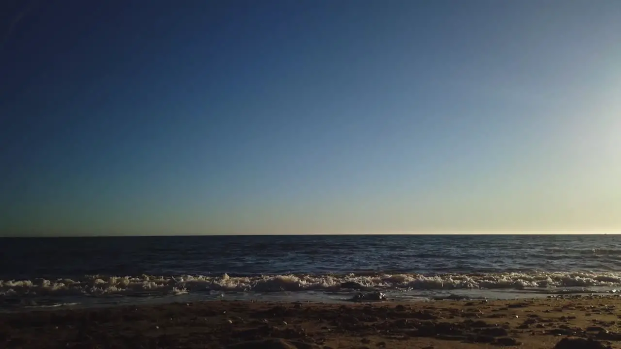 Beach time lapse on a clear sky