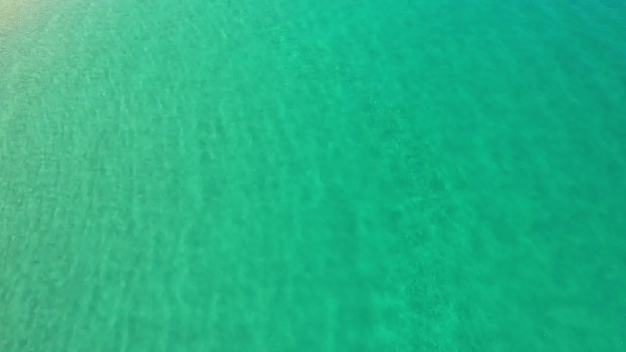 Aerial view over pristine crystal clear water