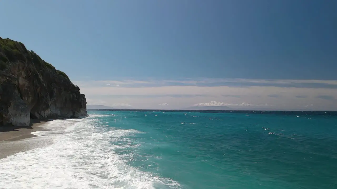 Aerial along coastal cliffs Gjipe Beach Albania