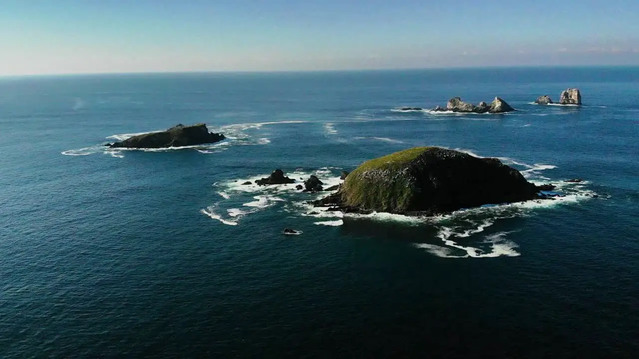 ROCKS IN THE MIDDLE OF THE SEA WITH DRONE