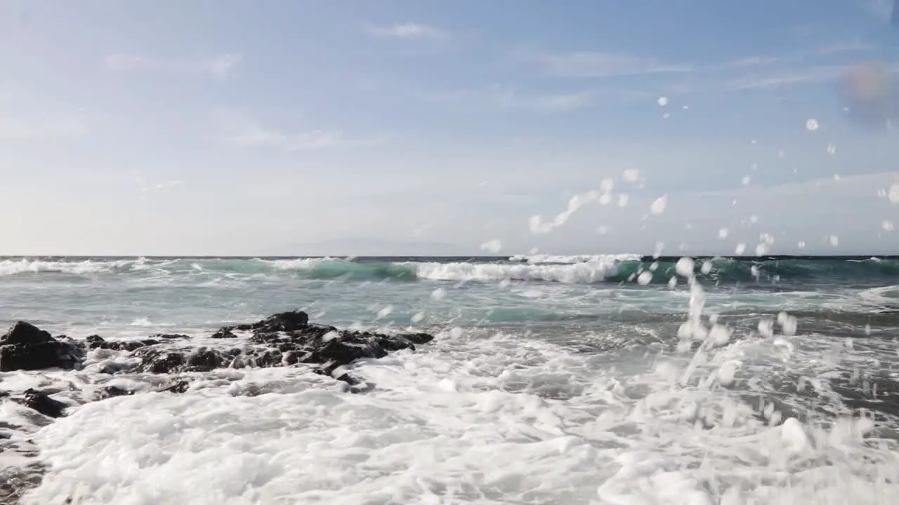 Waves crashing over rocks from the Atlantic ocean to the coastline Tenerife