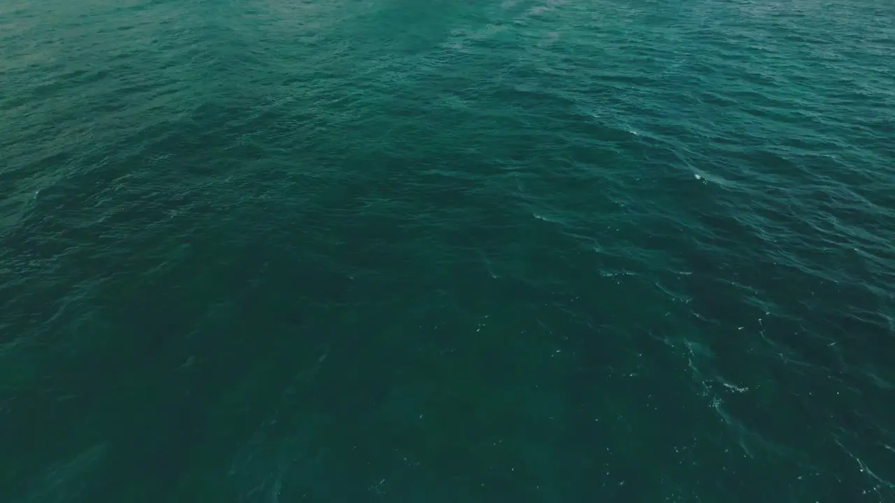 Slow aerial Move in to reveal cliff at Shipwreck Beach Hawaii