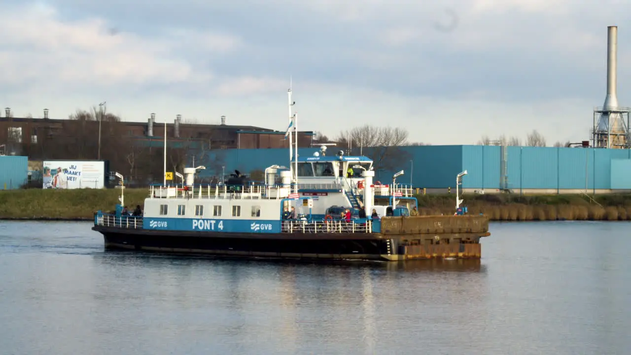 Following Amsterdam ferry crossing river wide