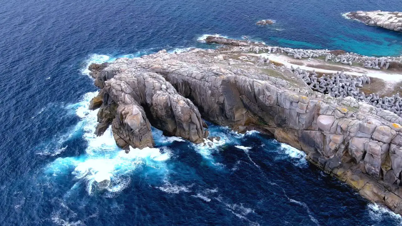 Scenic overview of extreme waves splashing on the rugged cliff called paper cliffs in Costa Da Morte Morás Xove Lugo Galicia Spain at dayitme