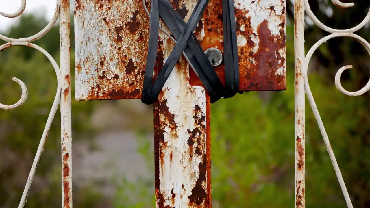 An old rusty fence with a lock tied and wired shut to discourage trespassers grunge look