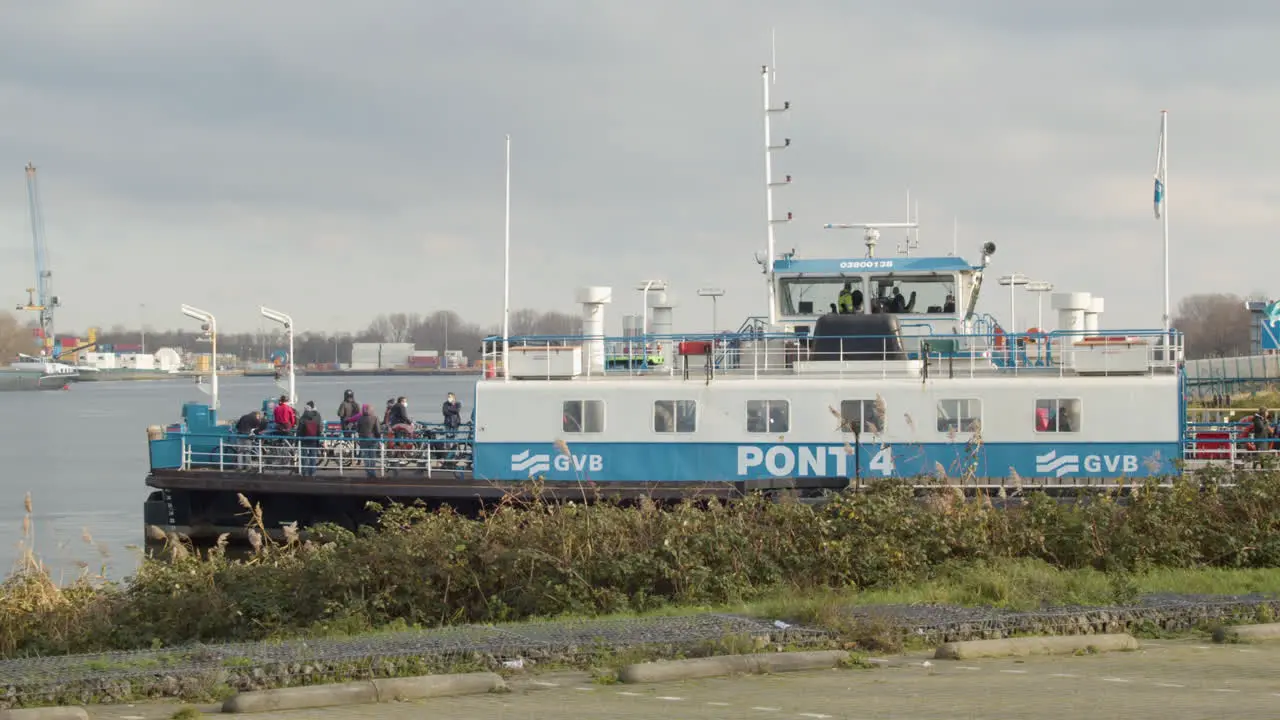 Amsterdam ferry leaving dock and crossing river in the Netherlands wide