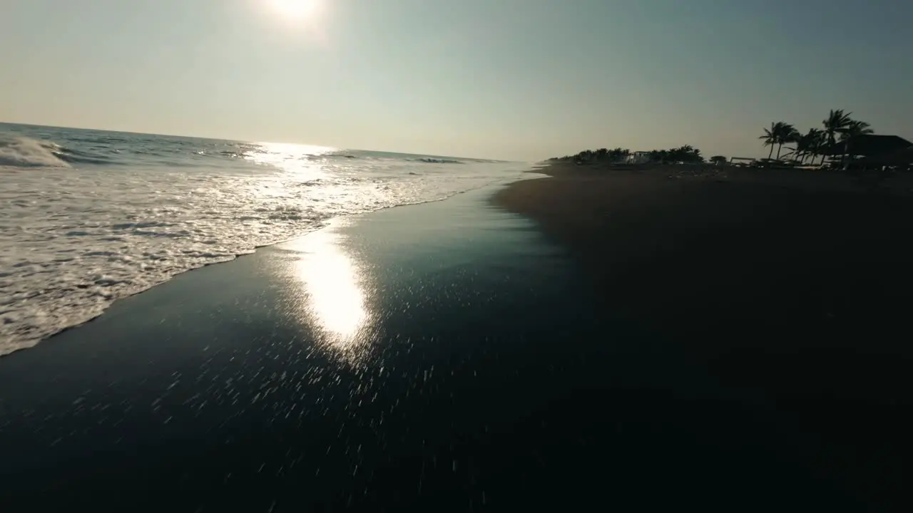 Flying Over Black Sand Beach With Waves Splashing In Monterrico Guatemala