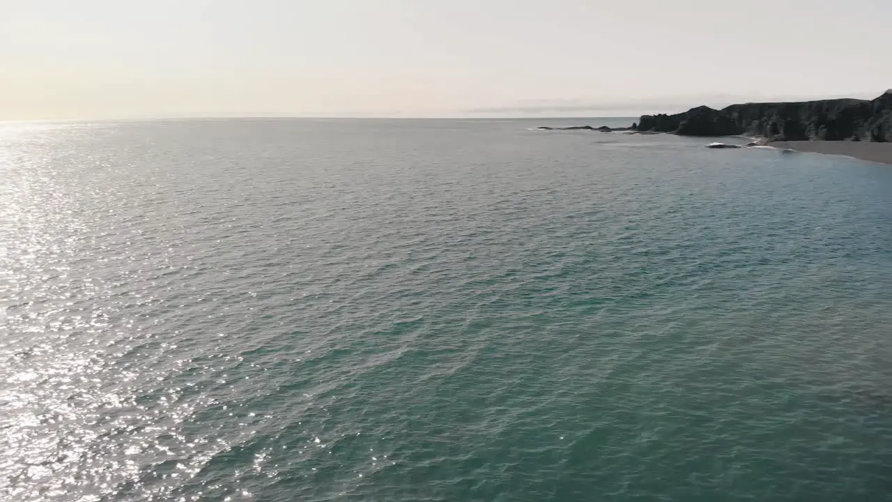 Beautiful cinematic aerial view of the famous Black Sand Beach seen from the town of Vic in Iceland