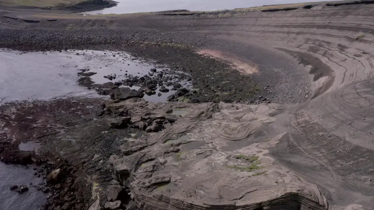 Stunning aerial of basalt beach on Home Island in Iceland rugged landscape