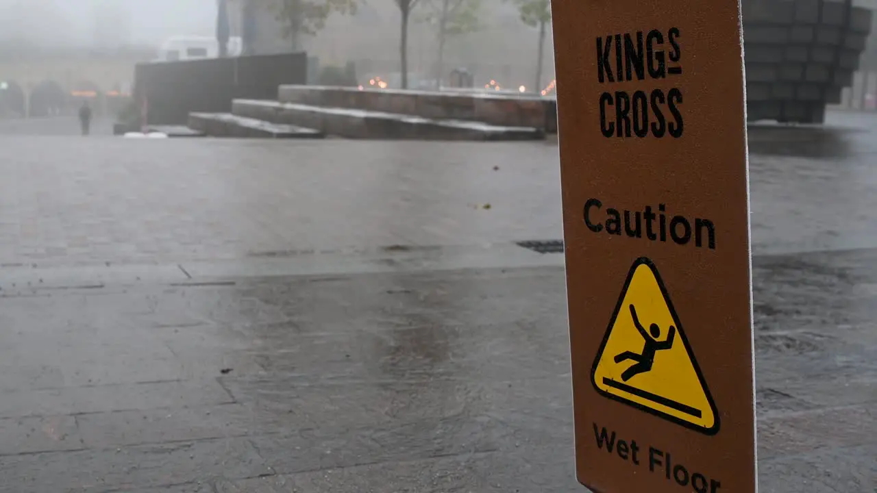 Caution Wet Floor in the Fog near to Kings Cross London United Kingdom