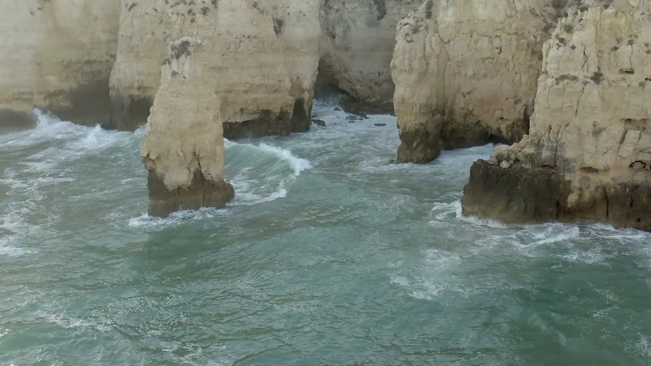 Slow Motion Waves Clashing Against a Cliff