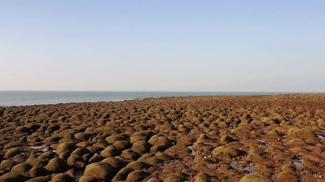 Low aerial view of low tide boulder field Hunstanton UK