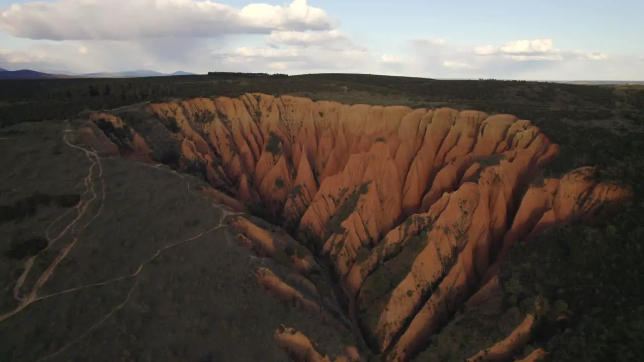 Drone Flight over Cárcavas desert limestone sand rocks formation at sunset Spain