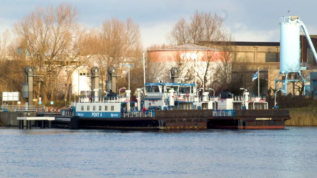 Amsterdam ferry leaving dock and crossing river