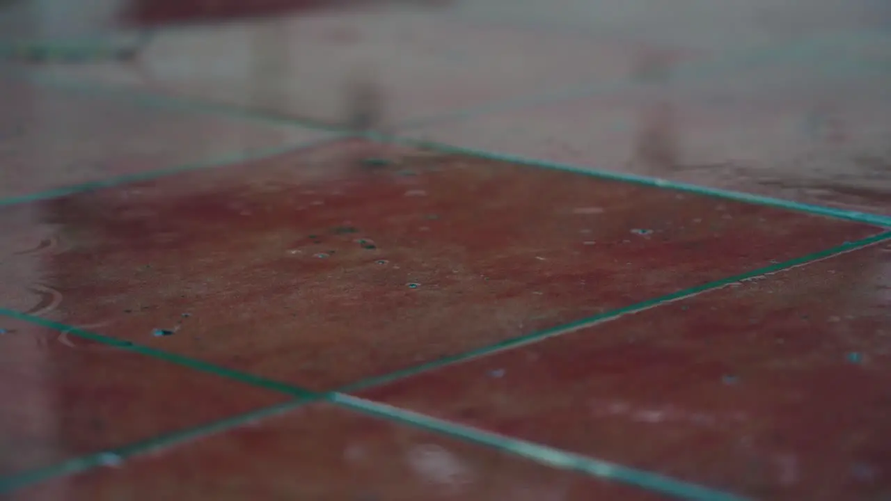 Rain falling on floor tiles